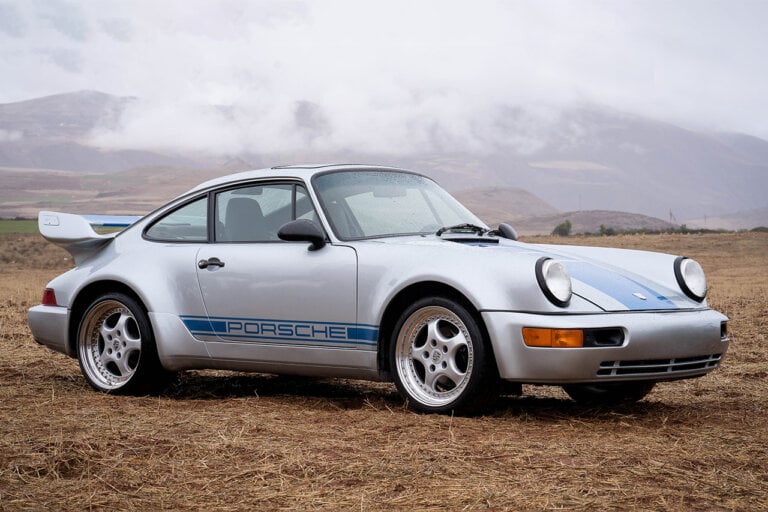 Silver and Blue Porsche 911 from Transformers parked on grass