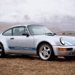 Silver and Blue Porsche 911 from Transformers parked on grass