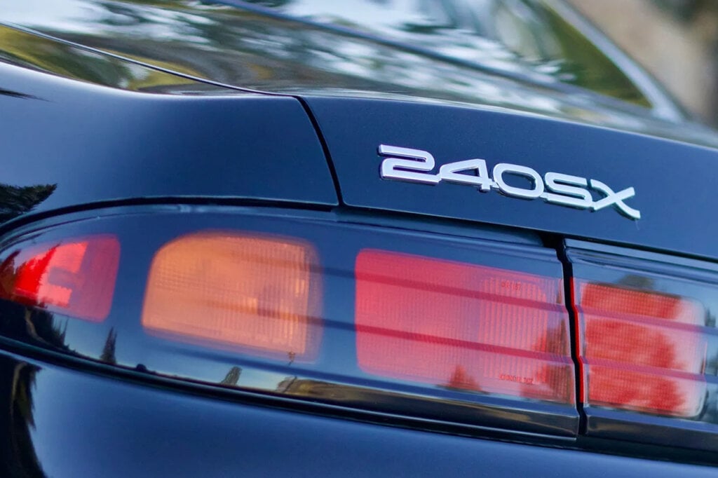 Nissan 240sx Badge above the red and orange taillights