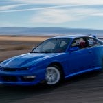 Blue Kouki S14 drifting through a turn