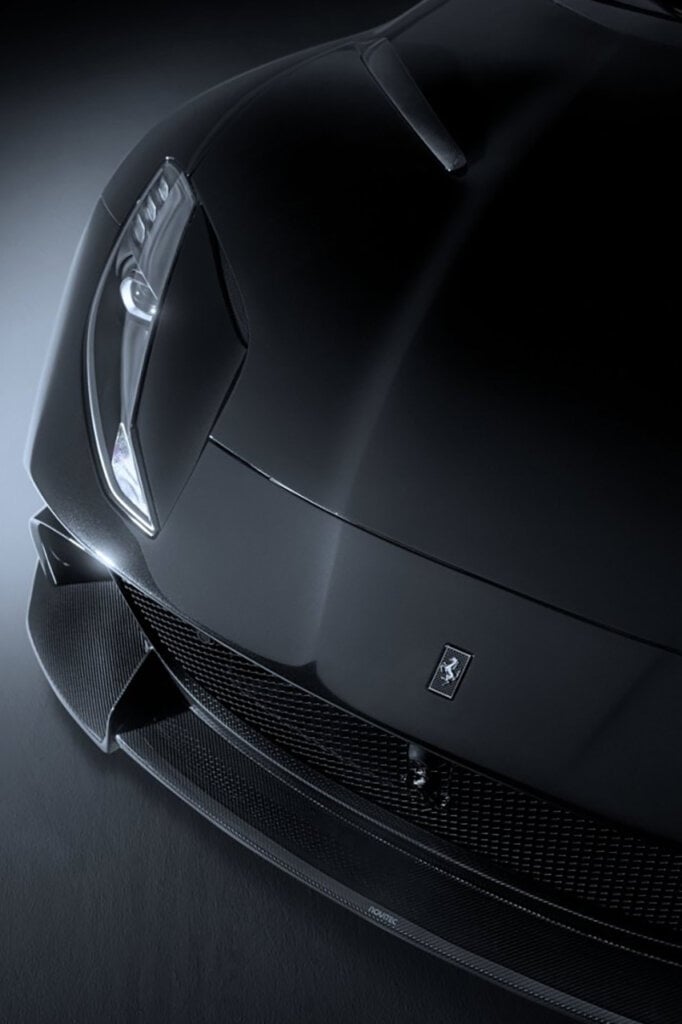 Closeup shot of a black Novitec N-Largo S with a carbon fiber front lip