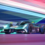Green Aston Martin Valkyrie with colorful streaks of light in background
