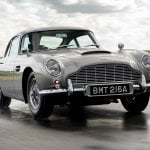 continuation programme aston martin db5 on a wet road