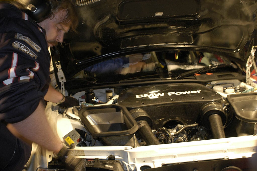 bmw mechanics inspecting bmw e36 m3 M3 GTR engine