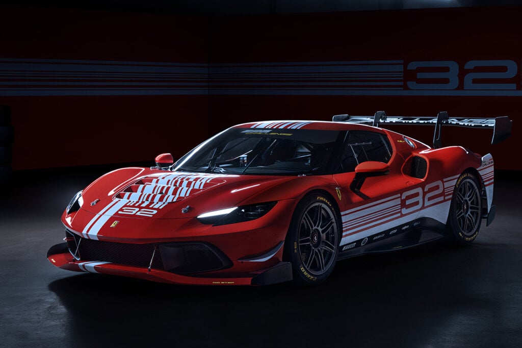 Red Ferrari 296 Challenge parked in a dark garage