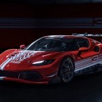 Red Ferrari 296 Challenge parked in a dark garage