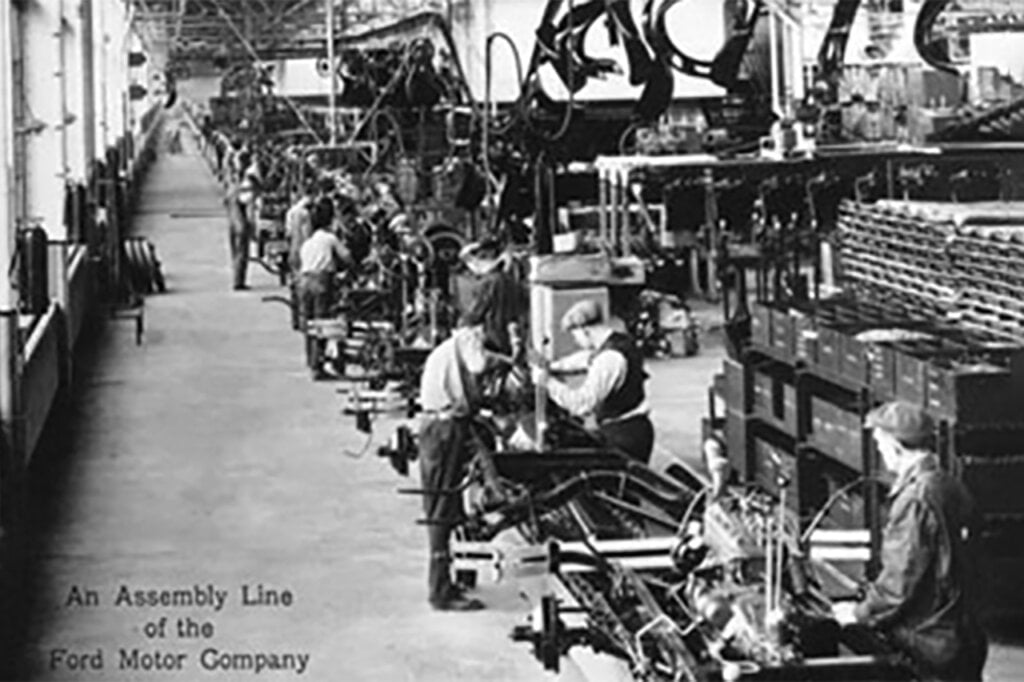 Employees working on an assembly line from Ford Motor Company
