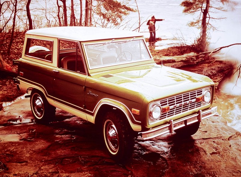 1976 ford bronco next to a lake