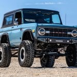 pale blue 72 ford bronco in a desert