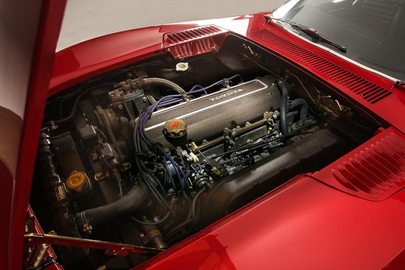 2000GT 2L 3M engine inside the engine bay with the hood propped open