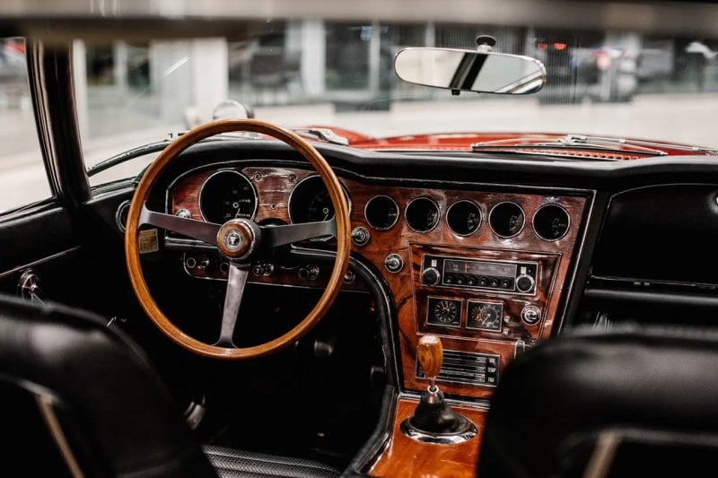 Interior of the 2000GT with leather and wooden panels on the dashboard