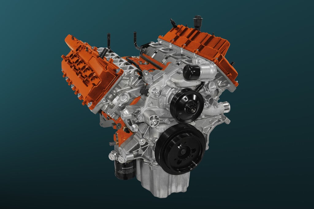Orange and silver Redeye engine on a green and black background