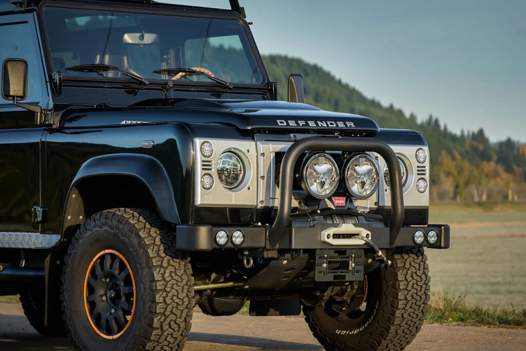 close up of Land Rover Defender with big lights on the front bumper