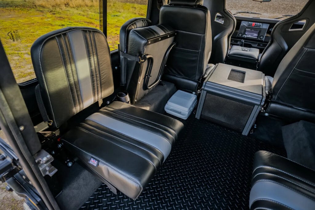 black and white leather interior seats of a modified Land Rover Defender