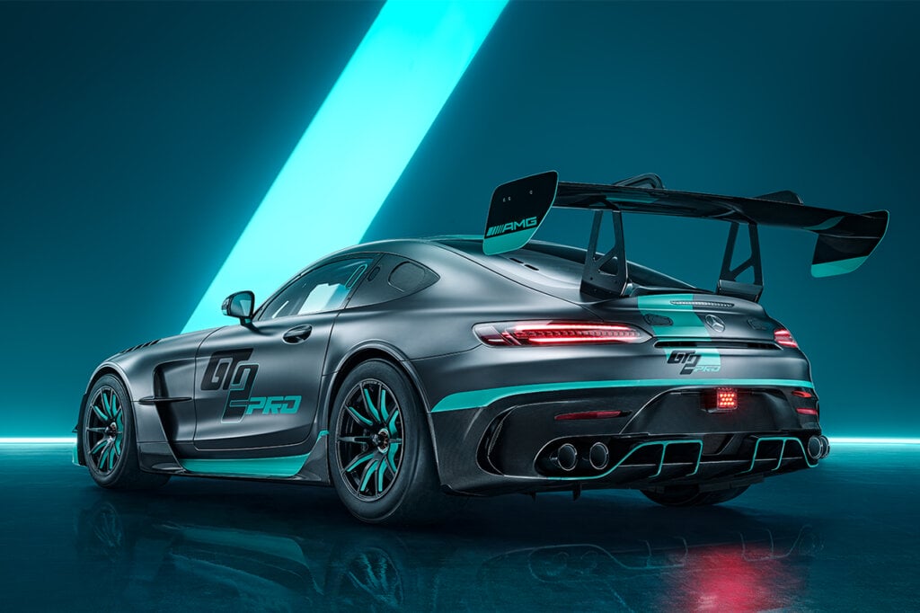 Black Mercedes AMG GT2 with a blue and black background
