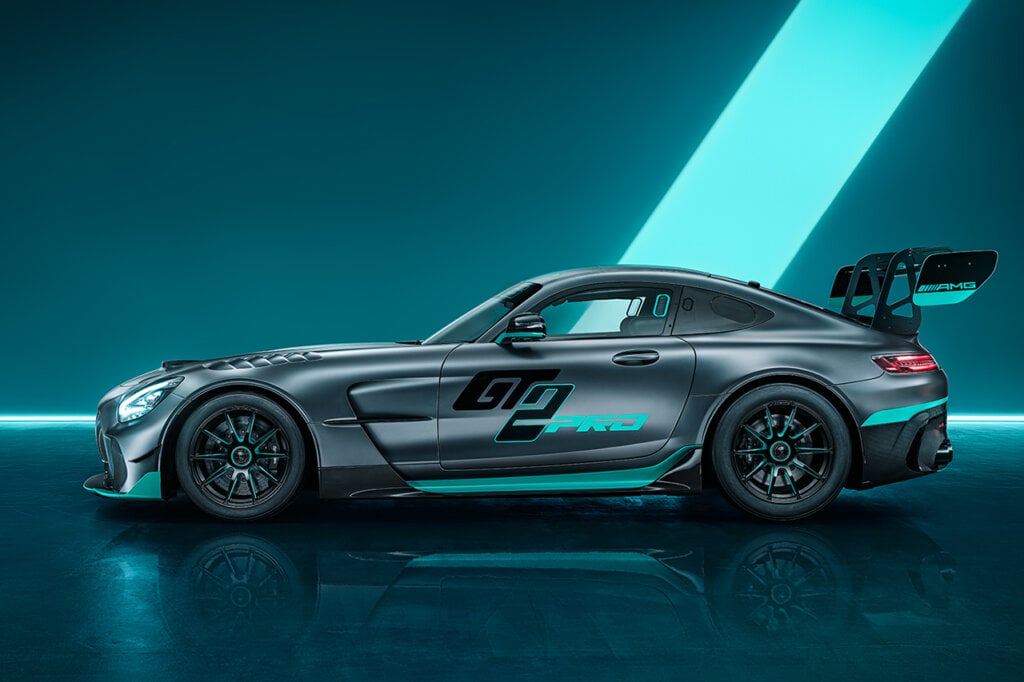 Side shot of the Mercedes AMG GT2 Pro on a blue and black background