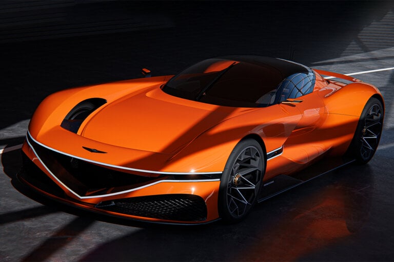 Orange Genesis X Gran Berlinetta Concept in a grey showroom