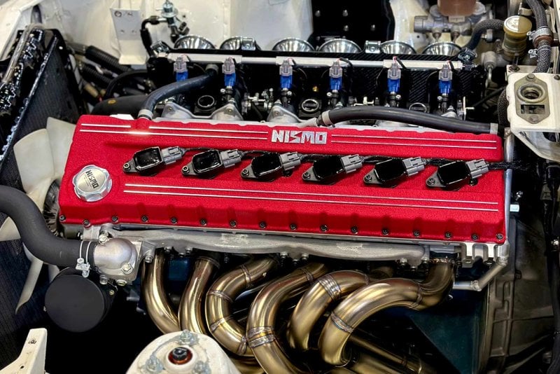 Close up of red valve cover upgrade on Nismo L-engine