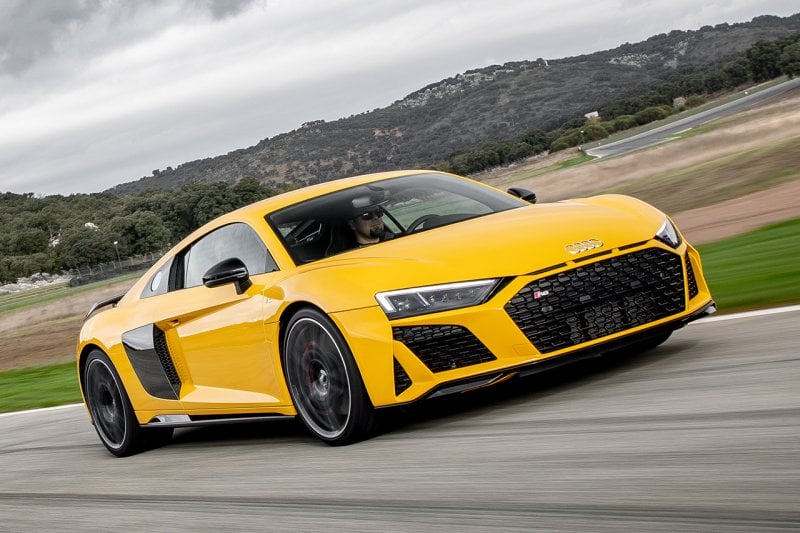 Yellow Audi R8 driving on a racetrack