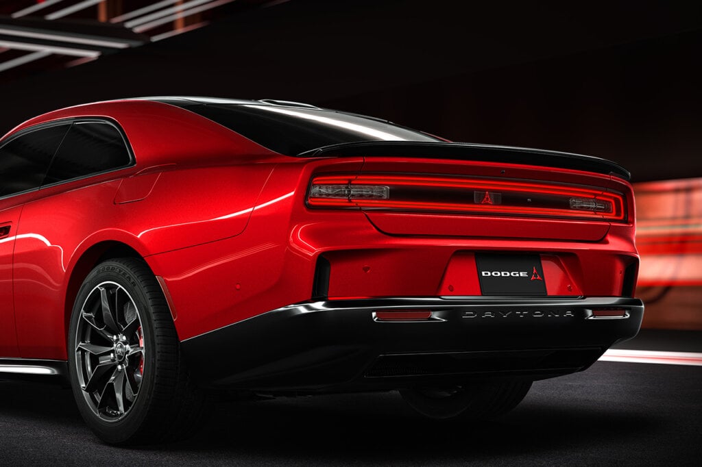 3/4 rear shot of new Red Dodge Charger on black background