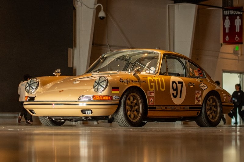 Brown Porsche 911 kit car with racing livery and number 97 on the door
