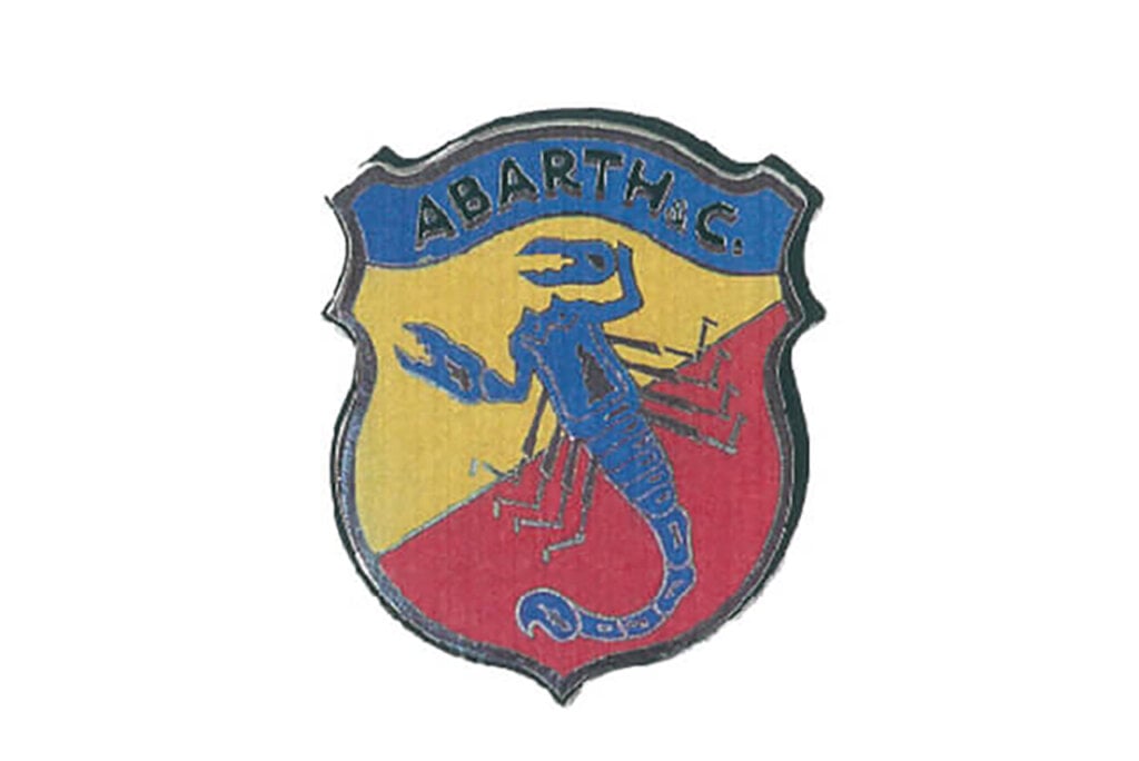 Yellow, blue, red with a scorpion on a shield Abarth logo