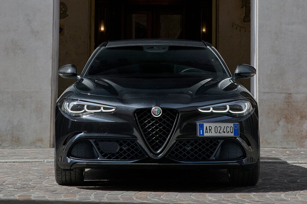 Front view of a black Alfa Romeo Giulia SS parked in front of a doorway