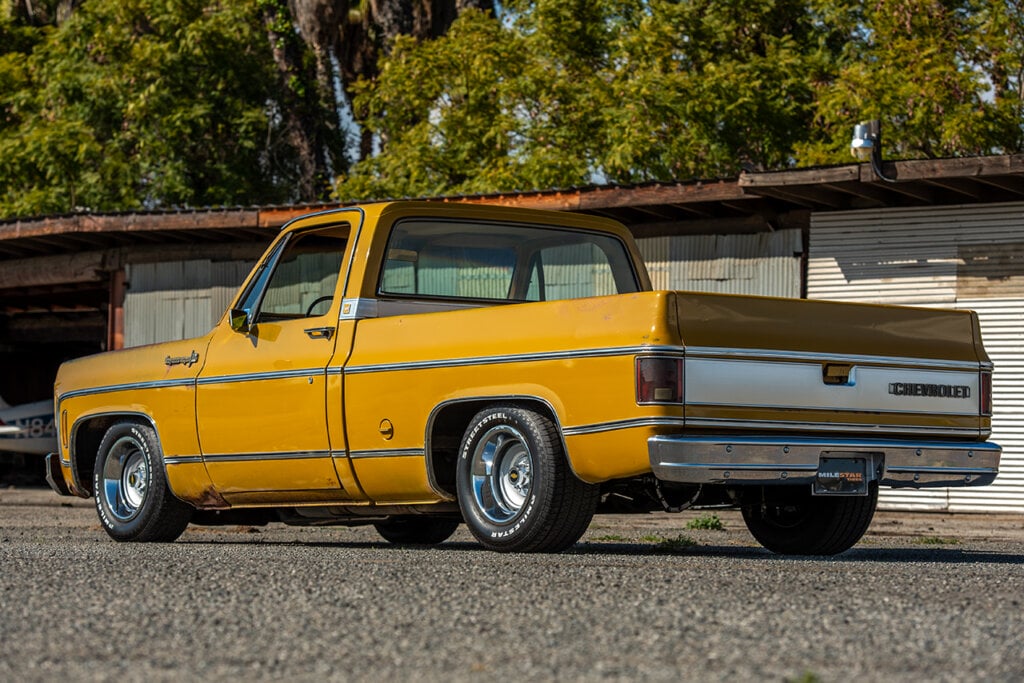 Rear view of a yellow Cheyenne Chevy C10 pickup truck