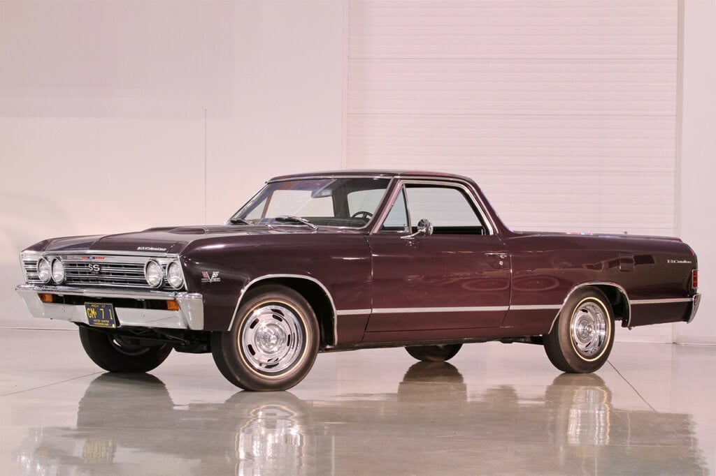 Black El Camino staged in a white room with reflective flooring