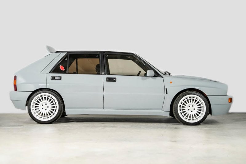 Side shot of grey Delta Integrale with white wheels