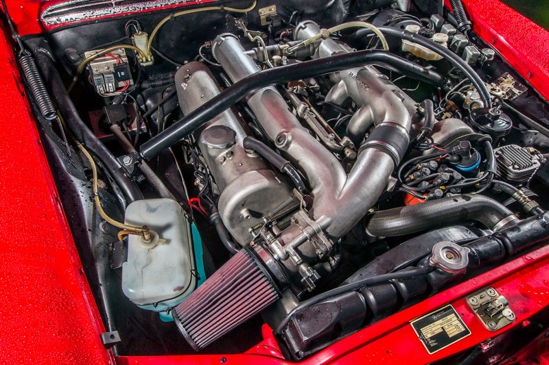 detail shot of an engine inside of a red car
