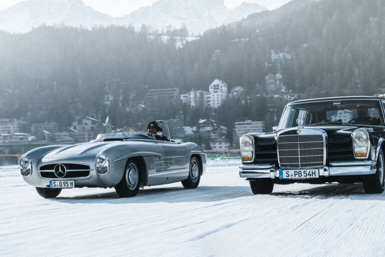 Silver and Black Mercedes Benz vehicles driving snow