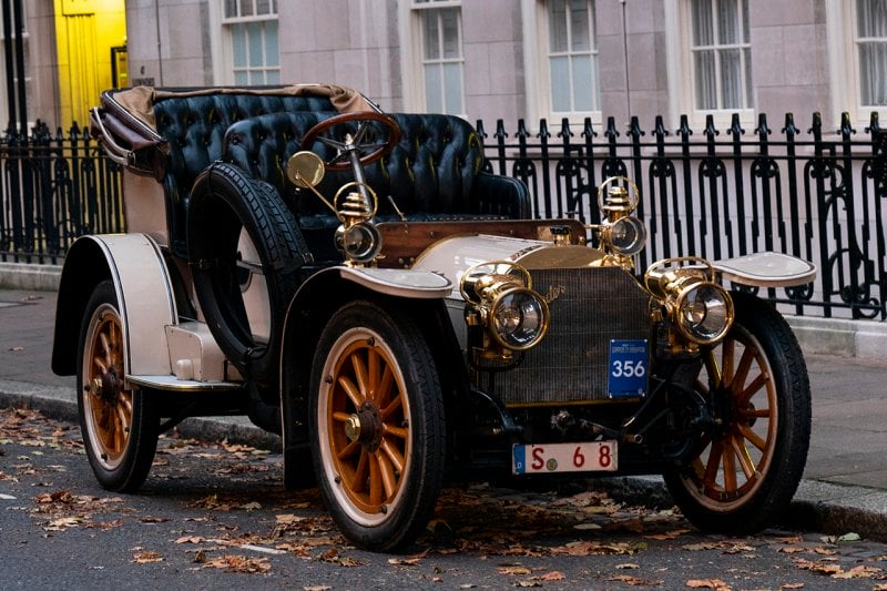 carriage car built by Mercedes-Benz company restored and parked in front of modern home