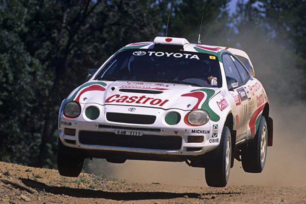 White Celica GT-Four flying through the air