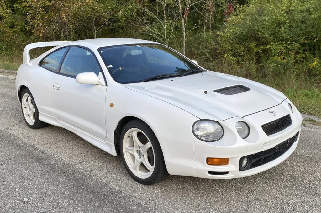 White Toyota Celica GT-Four parked in front of trees