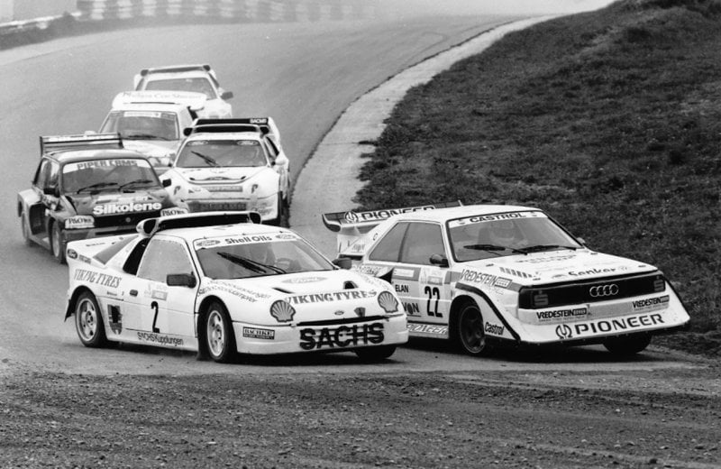 Black and white photo of Ford Escort right next to an Audi Quattro