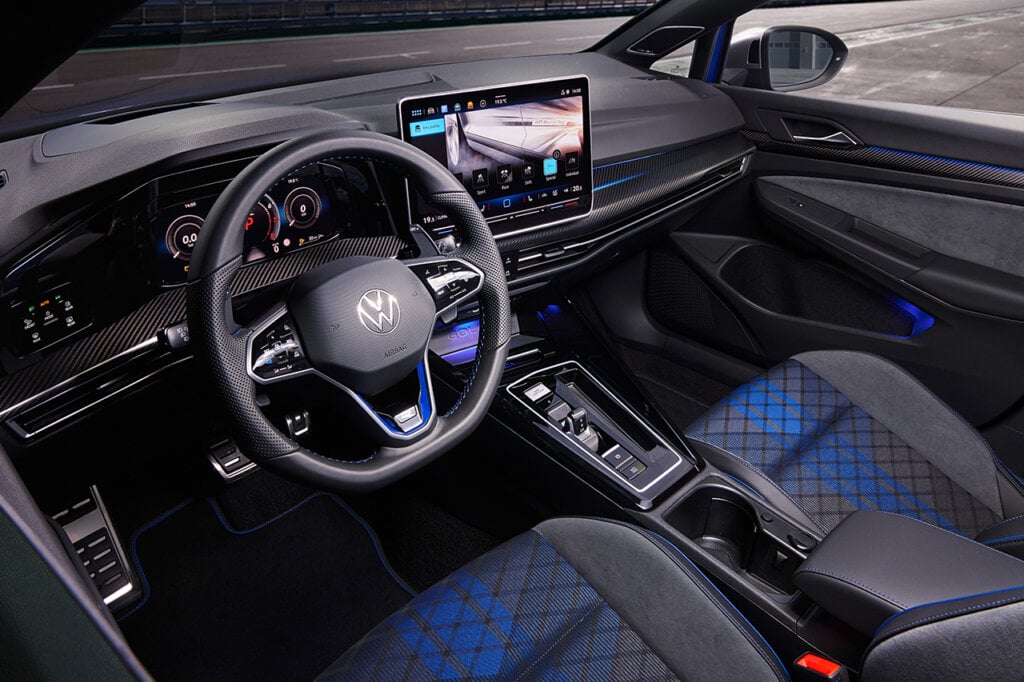 Interior of VW car with black leather and blue stitching