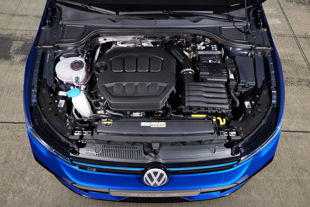 Closeup shot of an engine bay of a blue VW car