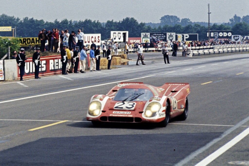 red white porsche 917 kh at the start line on race track